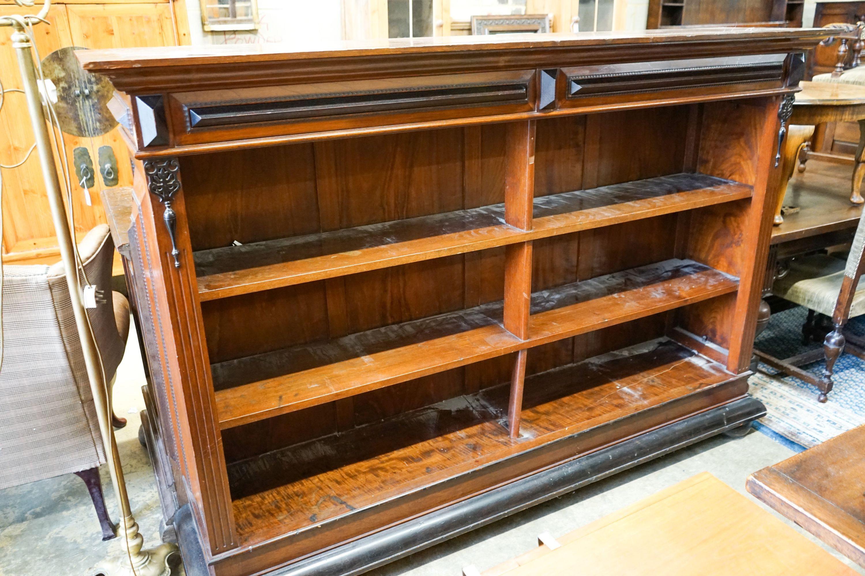 A 19th century Dutch mahogany and ebonised three-tier open bookcase of large proportions, length 216cm, depth 48cm, height 150cm